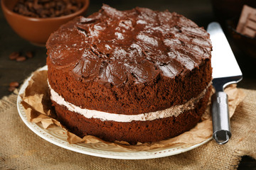 Delicious chocolate cake on table close-up