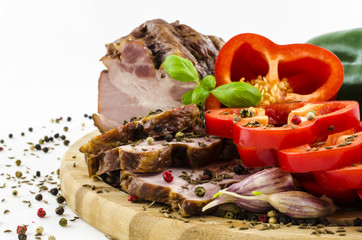 Close-up of bacon and paprika with spieces on wooden board