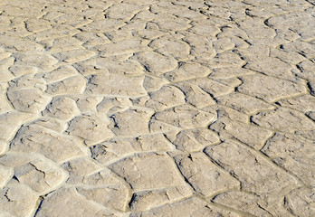 cracked and dry lakebed in the desert