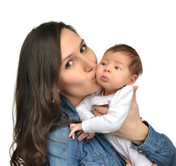 Mother hold and kissing beautiful infant child baby kid gi
