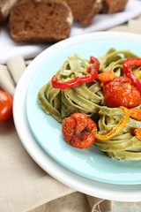 Tasty pasta with pepper, carrot and tomatoes