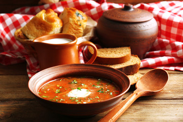 Ukrainian beetroot soup - borscht in bowl and pot,