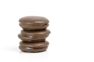 Stack of chocolate pieces on a white background
