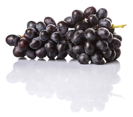 Black grapes over white background