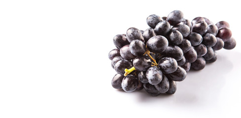 Black grapes over white background