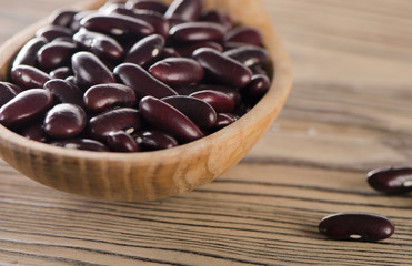 Kidney red beans in wooden  spoon.