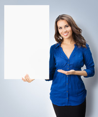 Young woman showing blank signboard