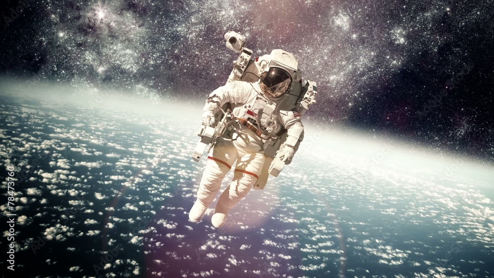 Wall mural astronaut in outer space against the backdrop of the planet eart