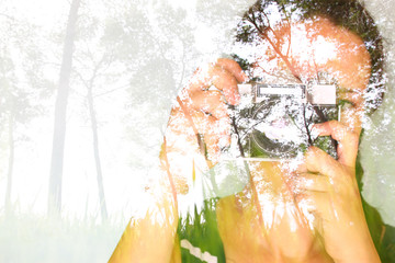 double exposure image of young girl holding old camera and natur