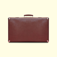 Retro vintage brown suitcase isolated on a white background