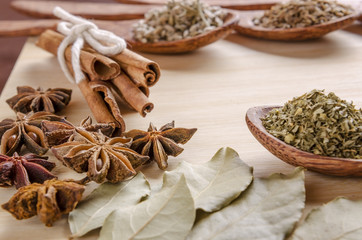 spoons and spices on cutting board