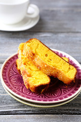 Two Slices of a tea cake with lemon on plate