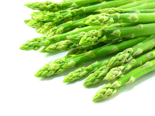 green raw asparagus isolated on white background