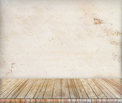 Backdrop sandstone wall and wood slabs arranged in perspective.
