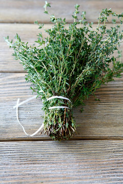 Fragrant thyme on wooden boards