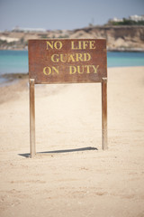 Warning sign on beach