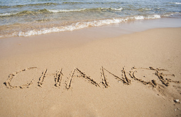 Word change written in sand
