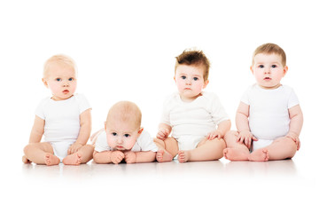Group of cute  babies, crawling, over white. playing babies