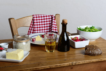 plate with radish and butter on a rustic table