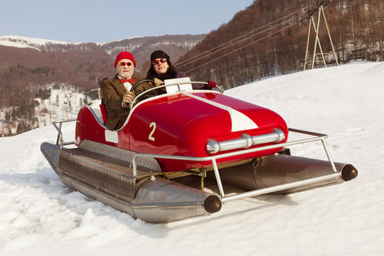 Sweet And Weird Couple Surfing On A Pedalos In Winter Time