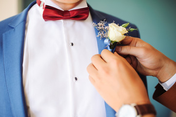 Pinning a Boutonniere