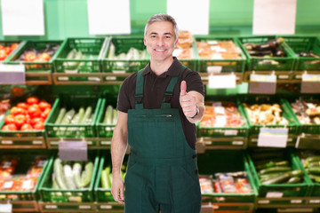 Male Sales Clerk Showing Thumb Up Gesture