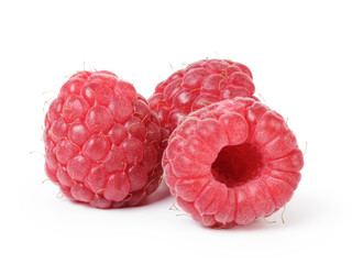 ripe red raspberries isolated on white