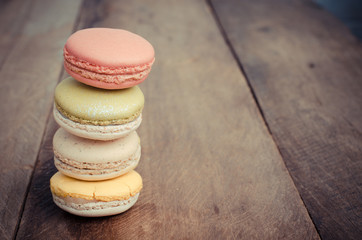 colorful macarons on a wooden floor