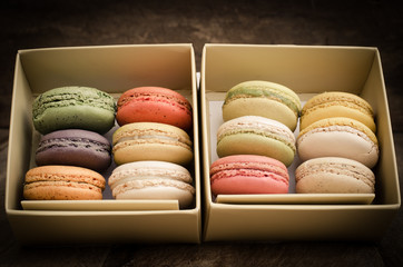 colorful macarons on a wooden floor