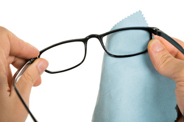 Person Cleaning Eyeglasses