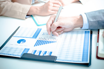 Business people discussing the charts and graphs showing the res