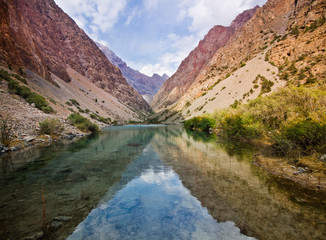 deep blue mountain lake reflects light