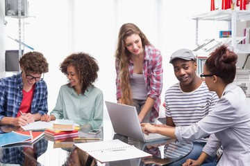 Fototapeta premium Fashion students working as a team