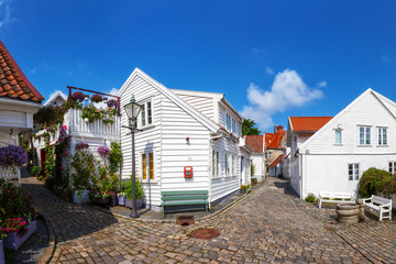 Fototapeta na wymiar Street with white houses in the old part of Stavanger, Norway