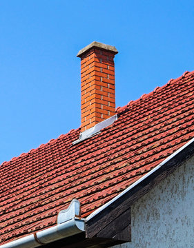 House roof with smoke stack