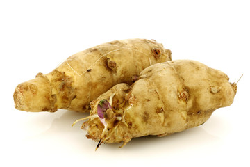 topinambur roots (helianthus tuberosus)on a white background