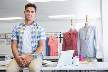 Fashion student with meter near models