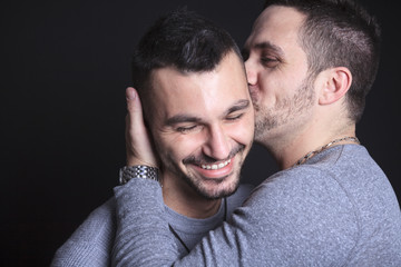 Gay couple on black background - obrazy, fototapety, plakaty