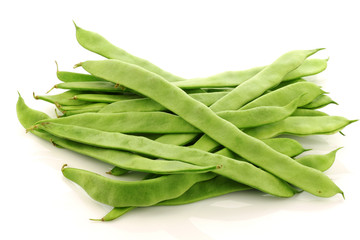 fresh string beans on a white background