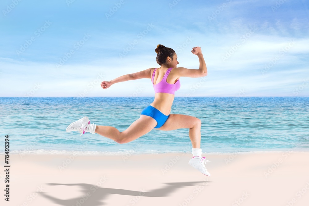 Poster Composite image of fit brunette running and jumping