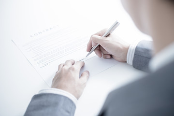 Business man signing a contract