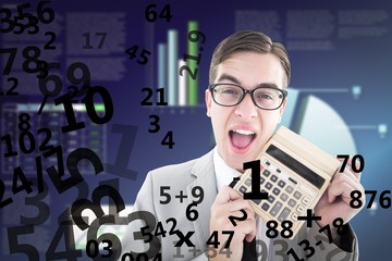 Composite image of geeky smiling businessman showing calculator