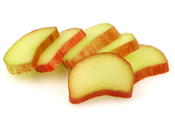 freshly cut pieces of rhubarb on a white background
