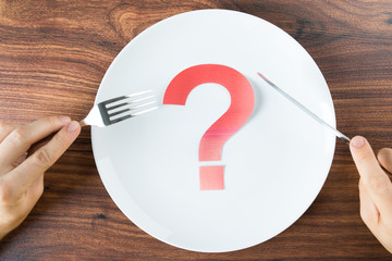 Plate With A Question Mark On Desk