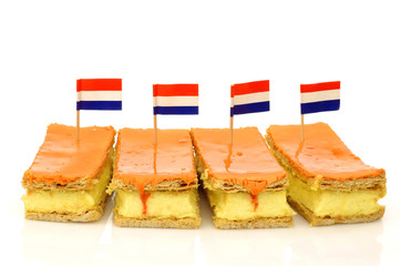Traditional Dutch pastry called "tompouce" with a Dutch flag