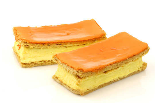 Traditional Dutch pastry called "tompouce" on a white background