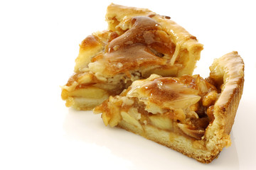 two pieces of fresh apple pie on a white background