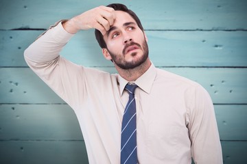 Composite image of portrait of a focused businessman
