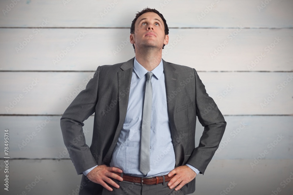 Poster composite image of serious businessman with hands on hips