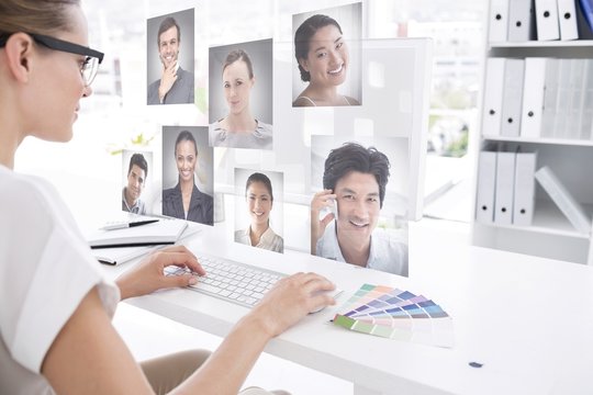 Composite image of female photo editor working on computer